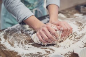 hands kneading the dough
